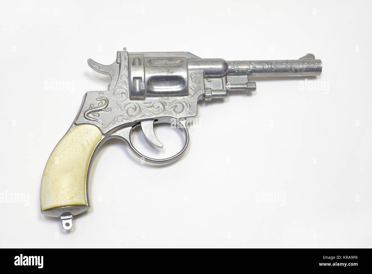 Pistola de juguete: revolver para disparar fulminantes, ornamentada, con  asas blancas Fotografía de stock - Alamy