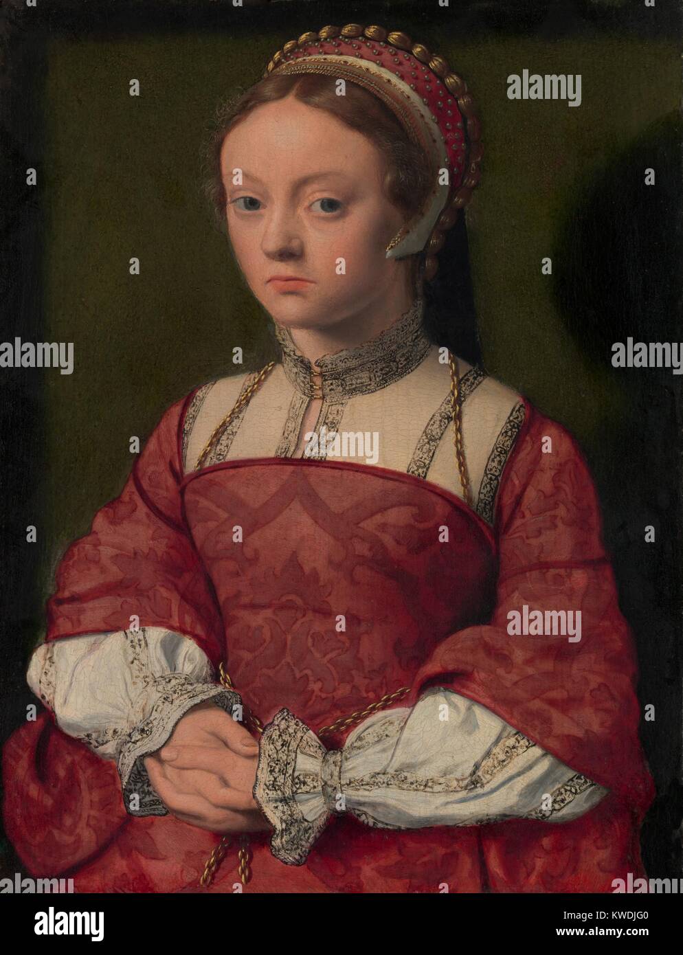 Retrato de una mujer joven, 1535, Netherlandish, Northern Renaissance pintura al óleo. Ella lleva un bordado de alta collared shift bajo un corpiño corsé vestido. Su tapa es adornado con trenza de oro y perlas (BSLOC 2017 16 115) Foto de stock