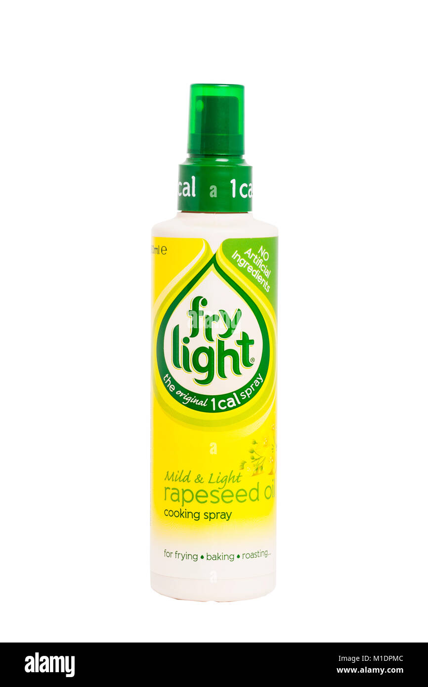 Una botella de luz fría 1 cal spray para cocinar el aceite de colza sobre un fondo blanco. Foto de stock