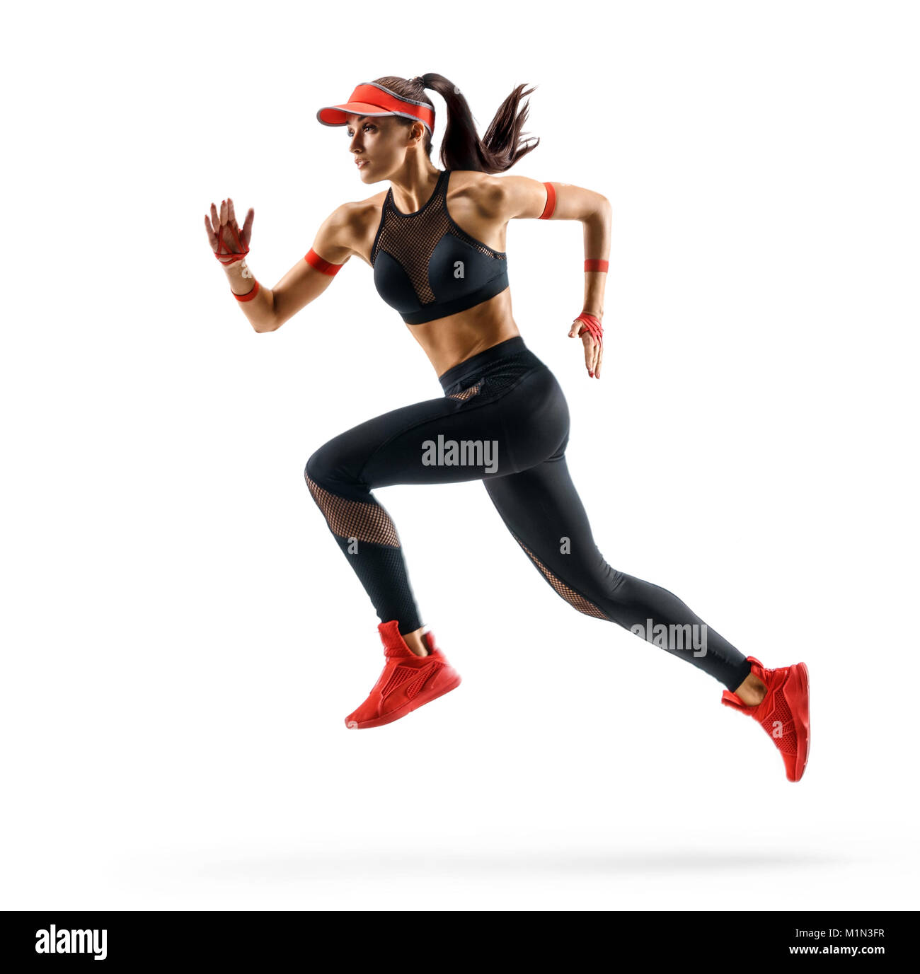 Mujer runner en silueta sobre fondo blanco. Movimiento dinámico. Vista lateral Foto de stock