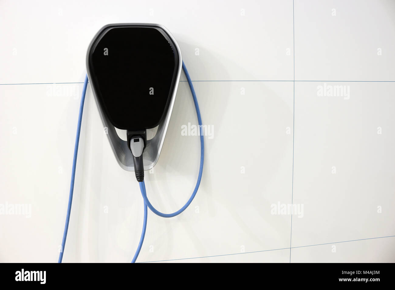 Cargador De Bateria De Coche Electrico En La Pared Foto Imagen