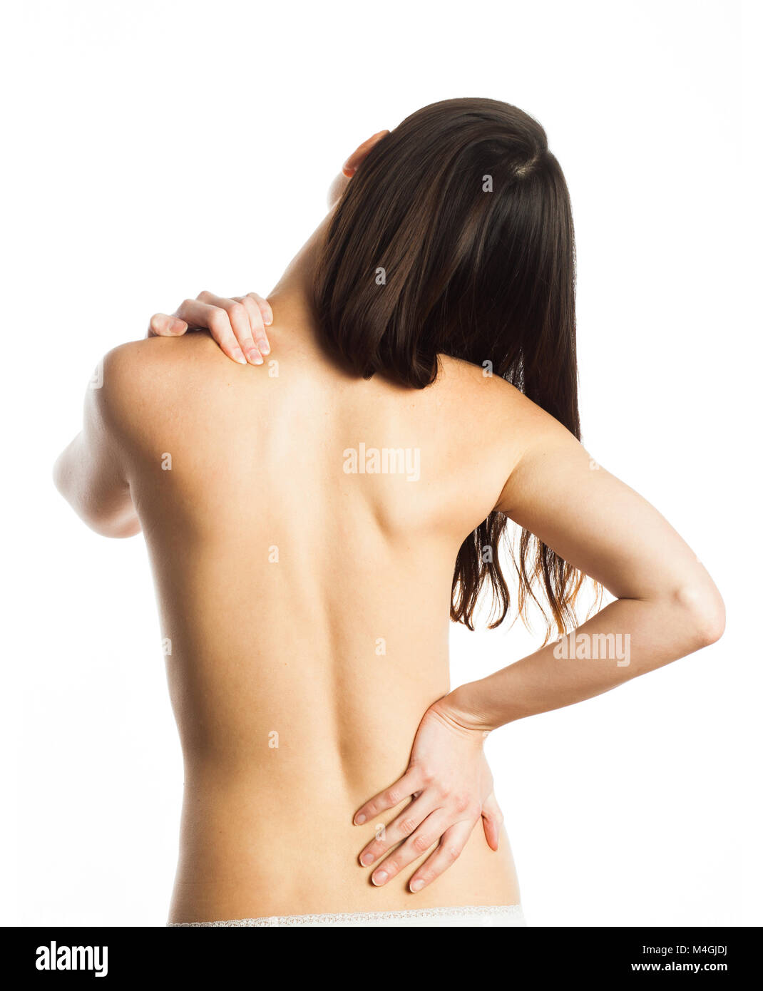 La mujer siente dolor en la espalda, aislado en blanco Foto de stock
