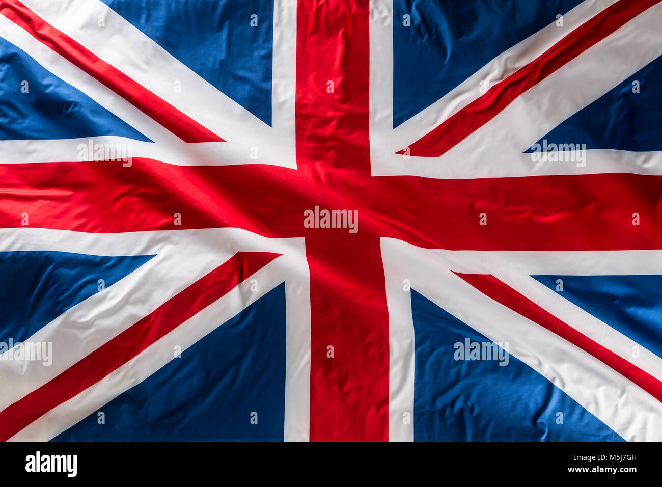 Primer plano de la bandera Union Jack. La bandera del Reino Unido. Union  Jack británica bandera ondeando al viento Fotografía de stock - Alamy