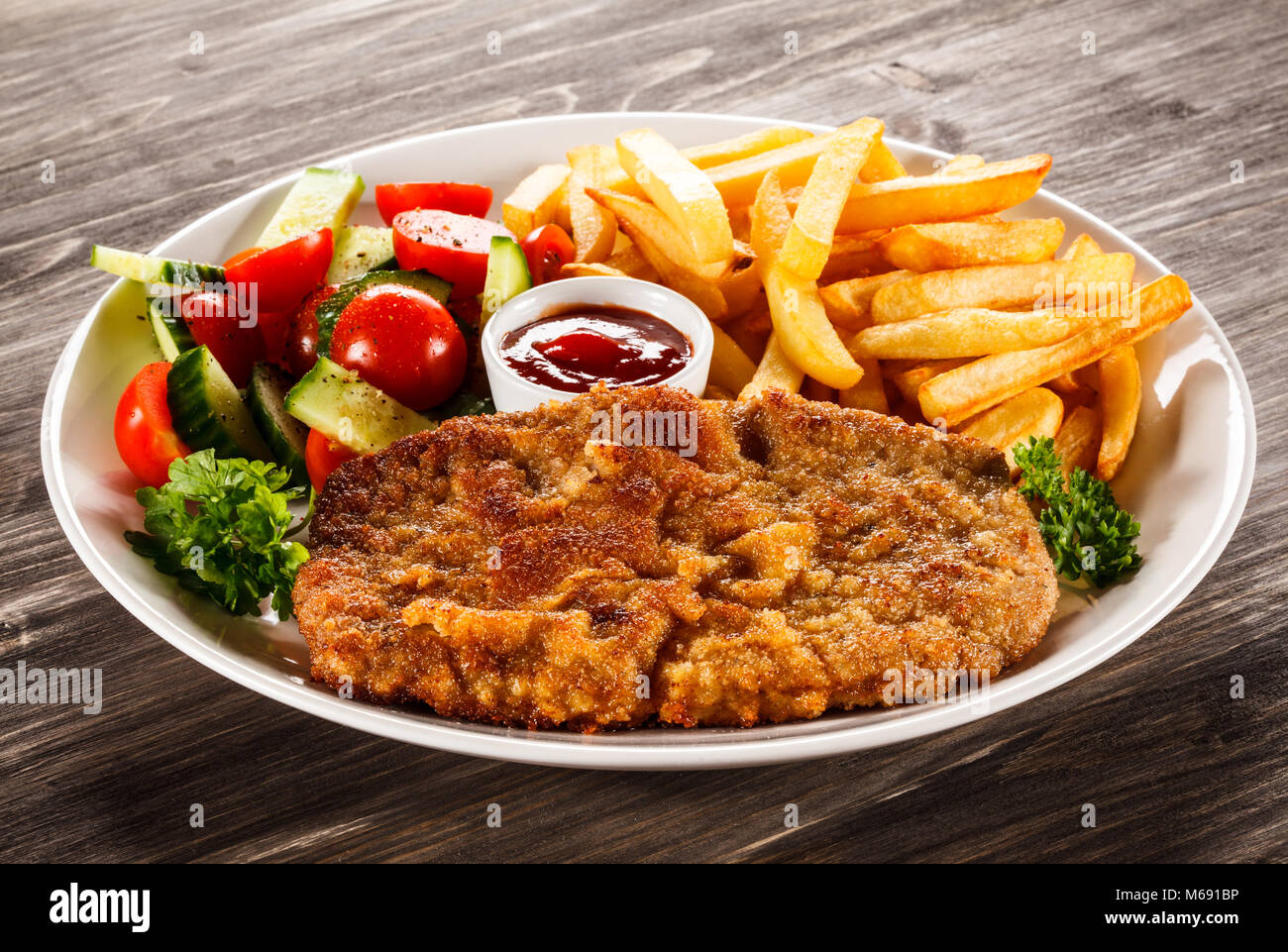 Pork Chop fritos, patatas y verduras Foto de stock