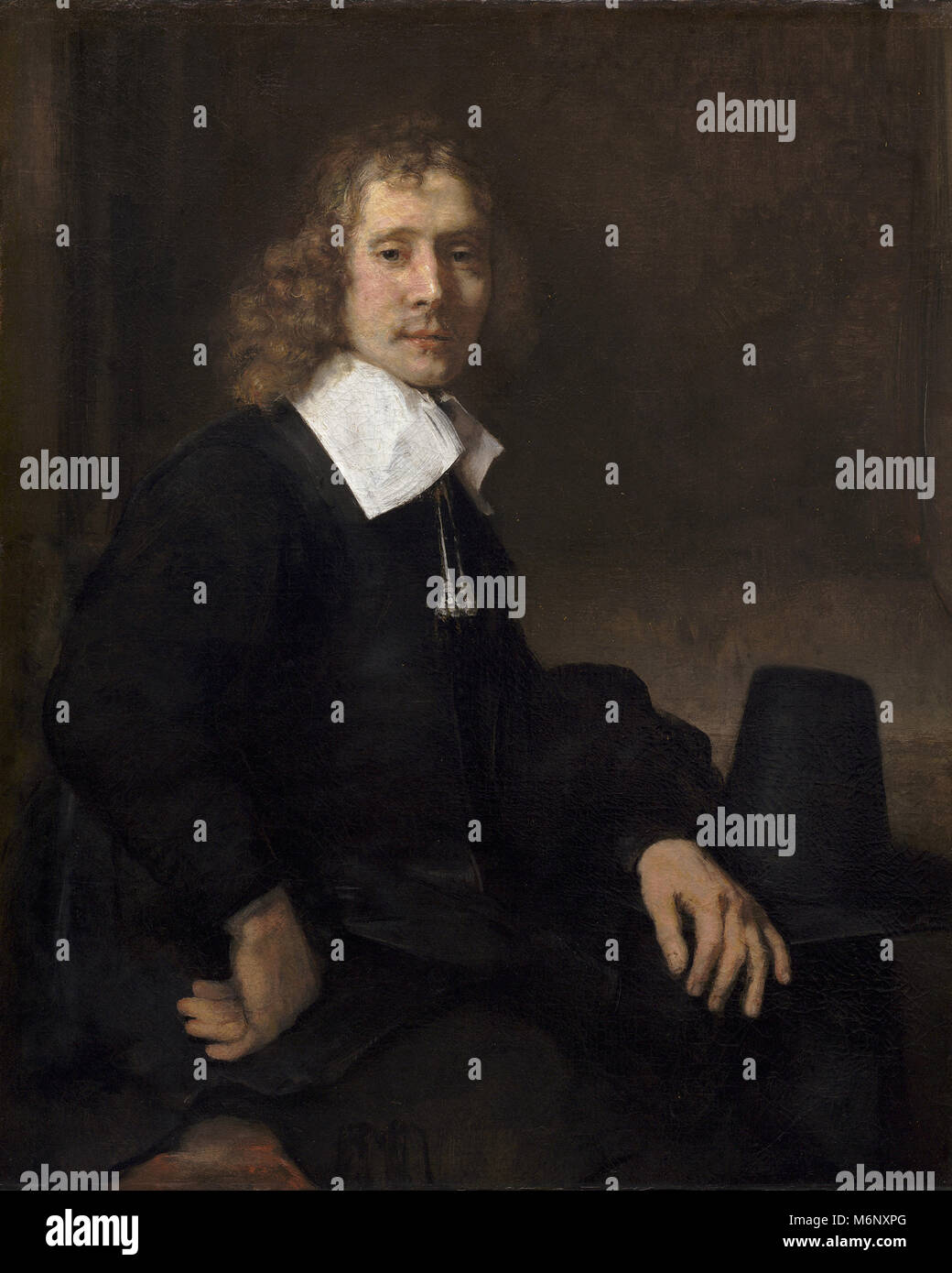 Rembrandt Harmenszoon van Rijn, un joven sentado en una mesa (posiblemente Govaert Flinck) Foto de stock
