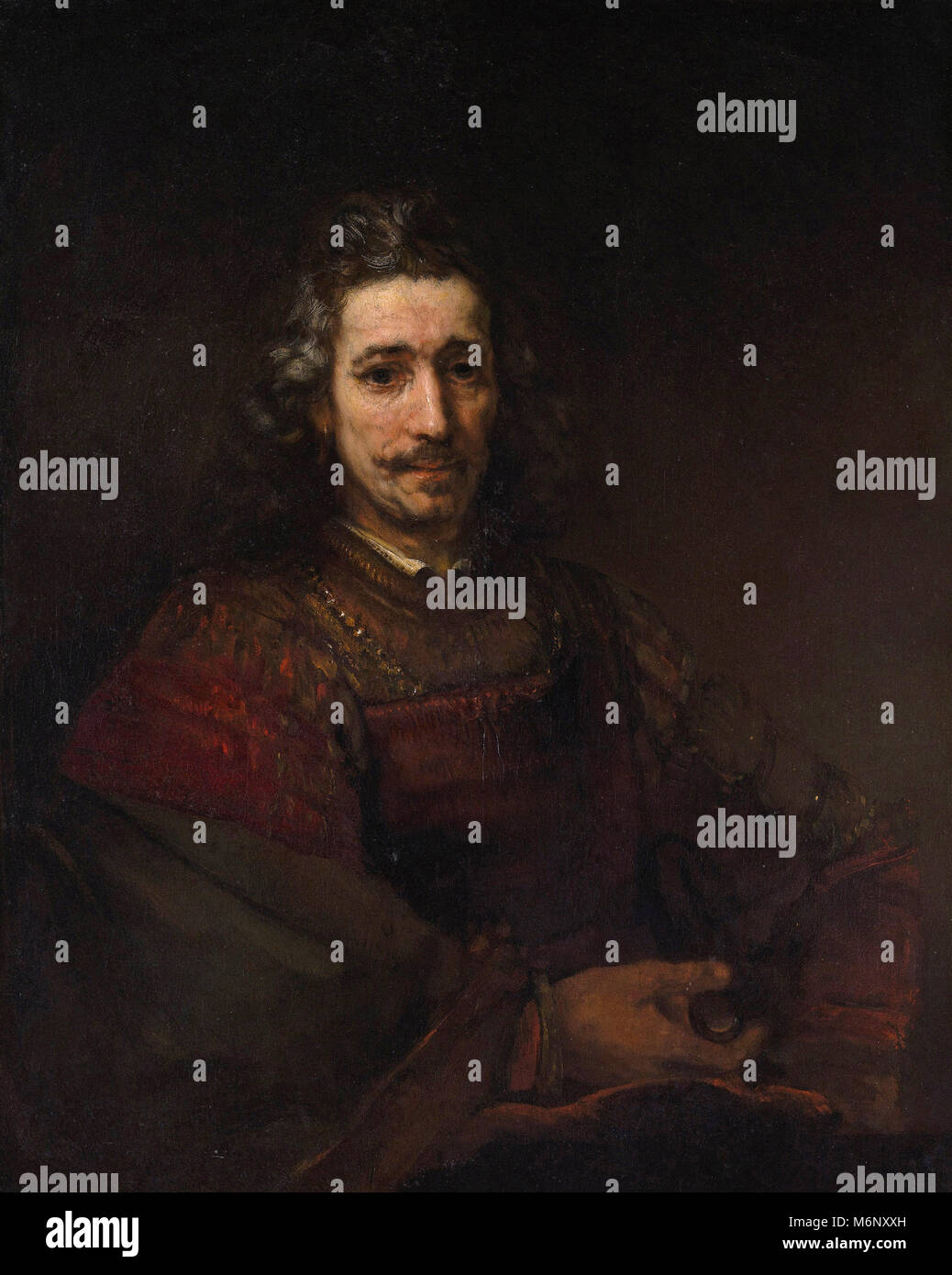 Rembrandt Harmenszoon van Rijn - Hombre con una lupa Foto de stock