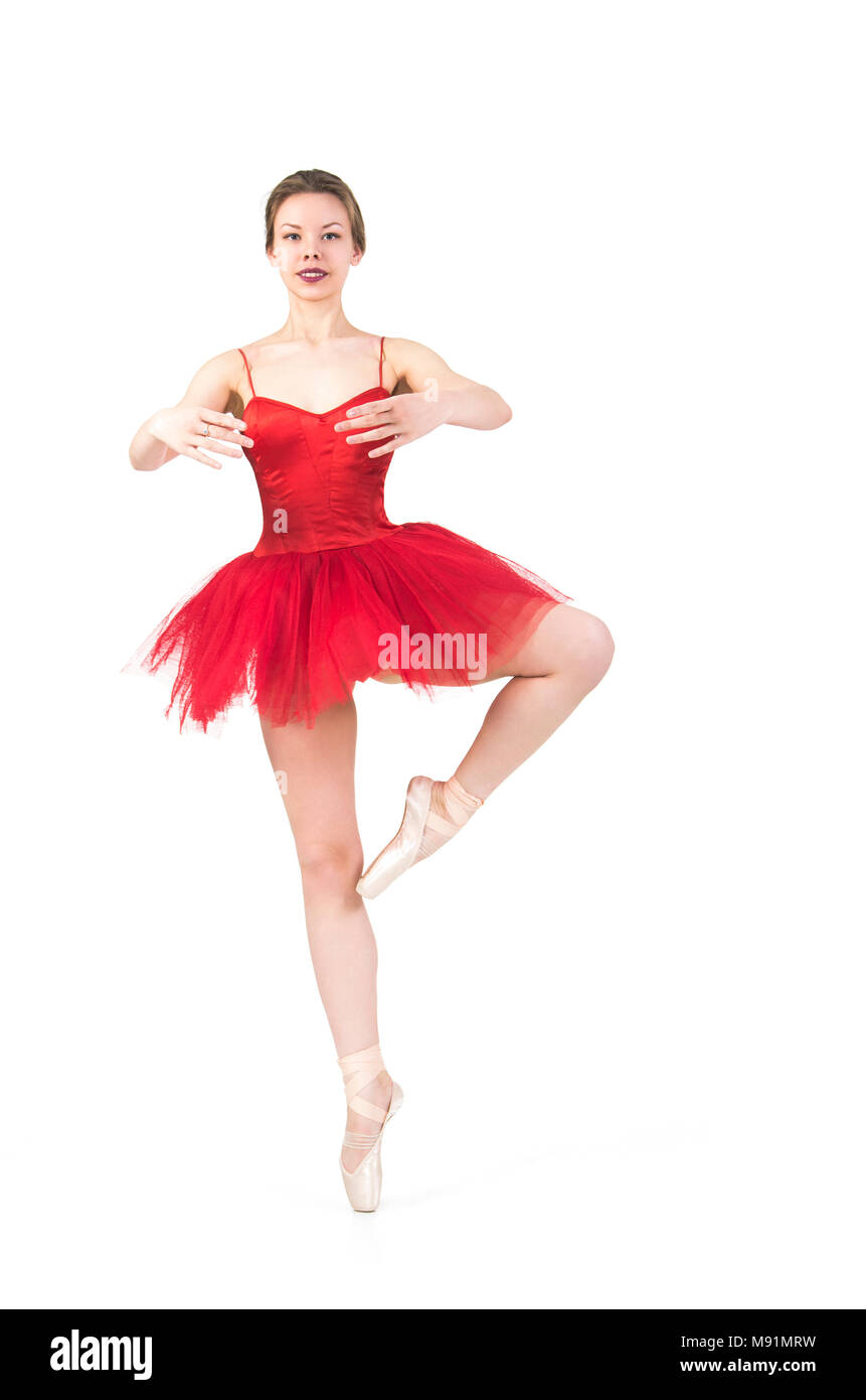 Una mujer en un tutú rojo bailando ballet. Estudio sobre fondo