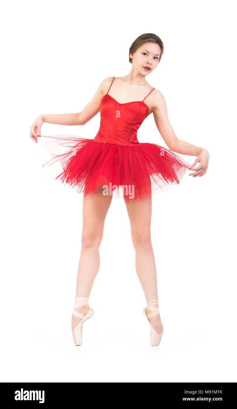 Una mujer en un tutú rojo bailando ballet. Estudio sobre fondo
