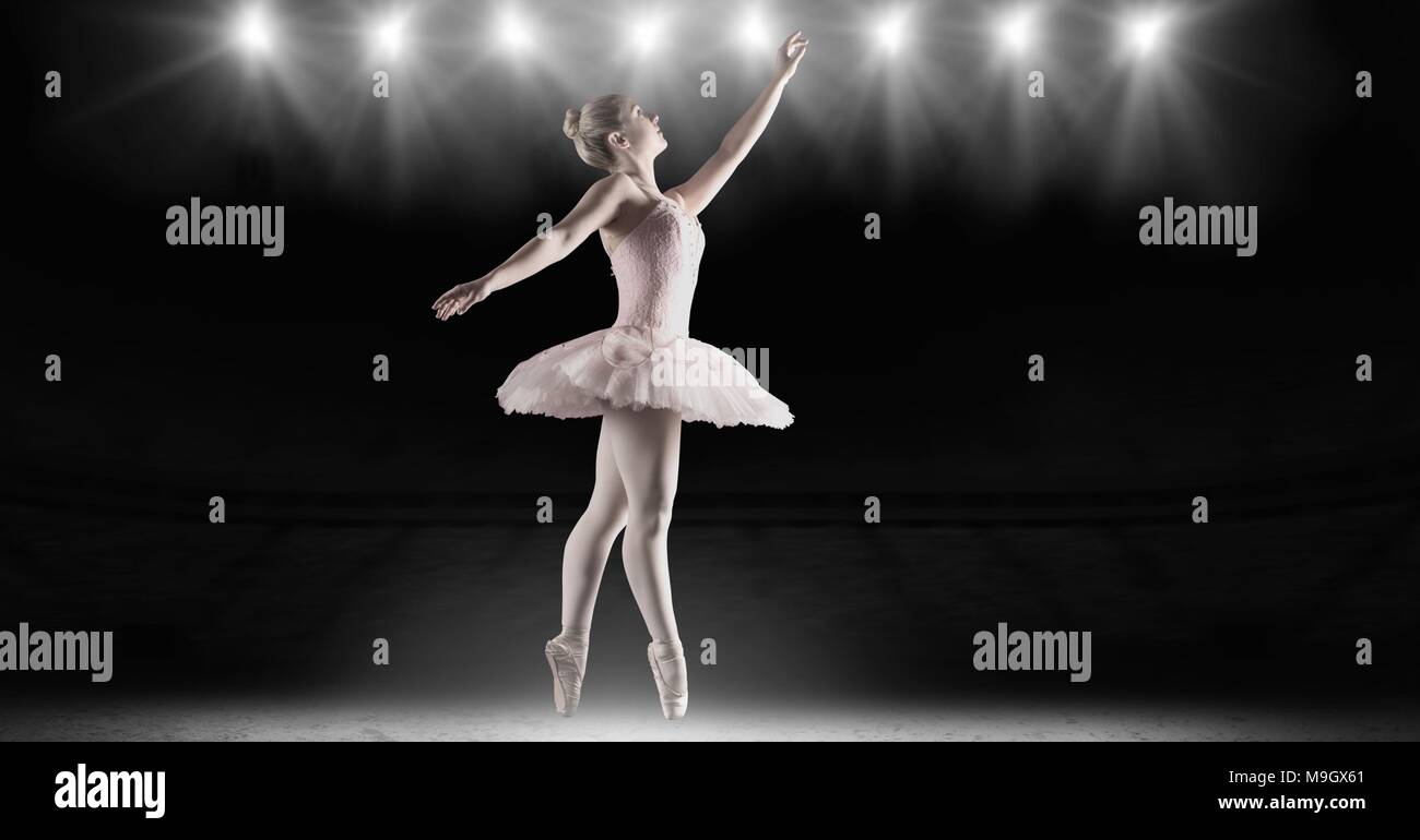 Bailarina de ballet bailando con estadio de luces de estrella Foto de stock
