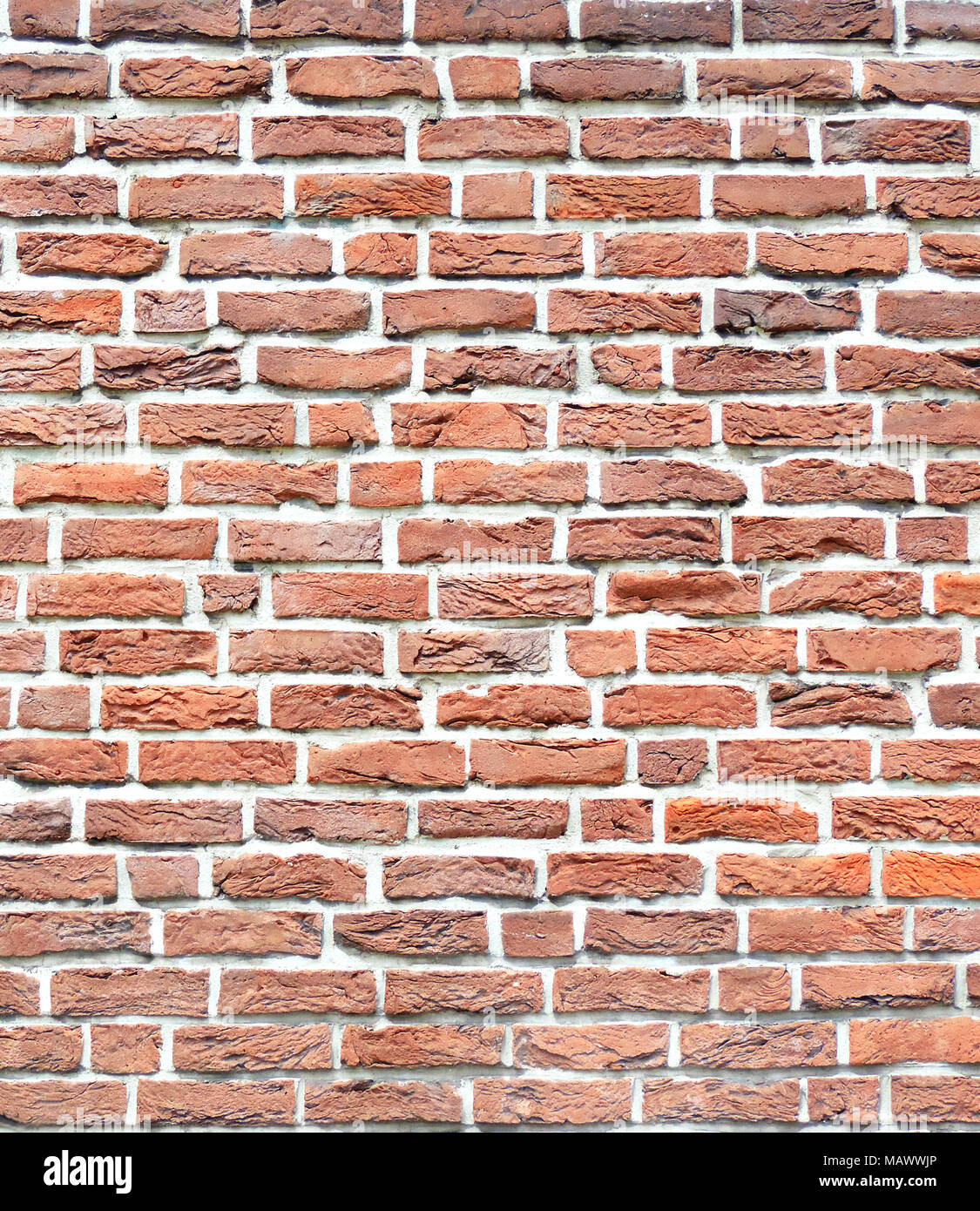 Muro de Piedra de ladrillo, con textura de fondo fondo de piedra. Disparo de fotograma completo de una pared de ladrillo rojo, como telón de fondo. Foto de stock