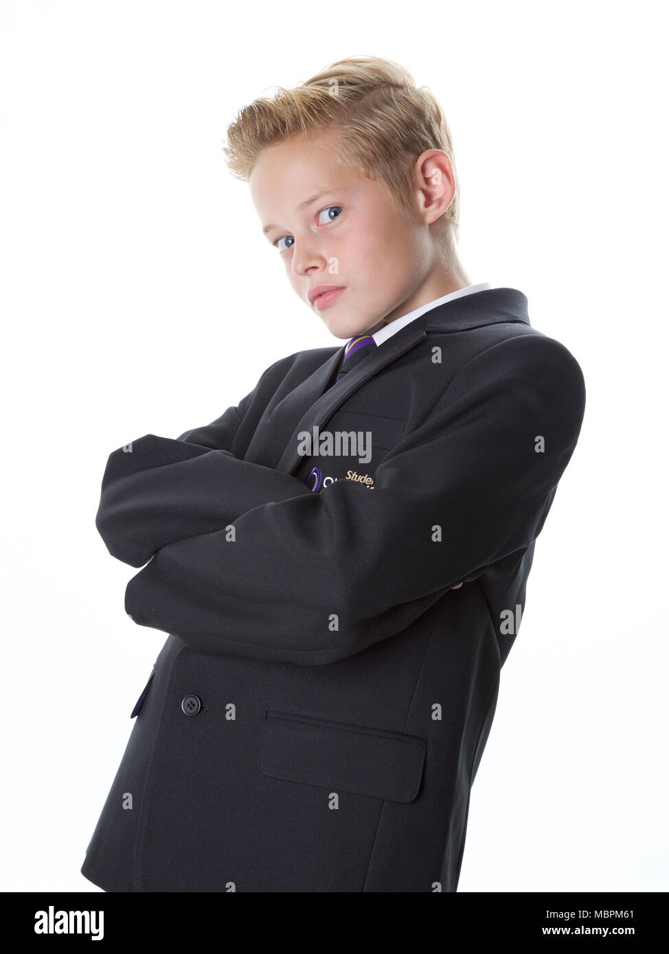 Chico en uniforme escolar con actitud Foto de stock