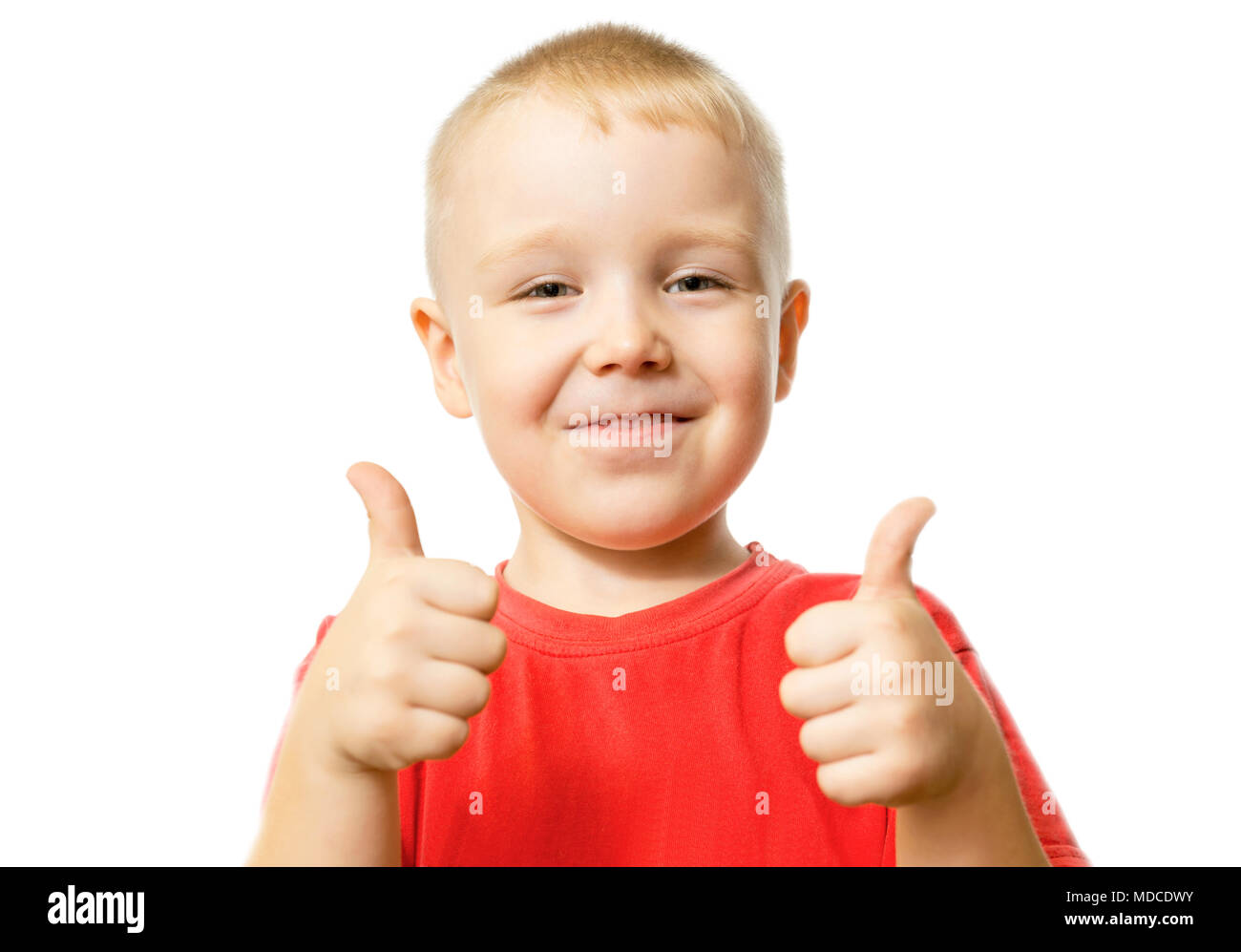 Retrato de muchacho feliz mostrando Thumbs up gesto aislado sobre fondo blanco. Foto de stock