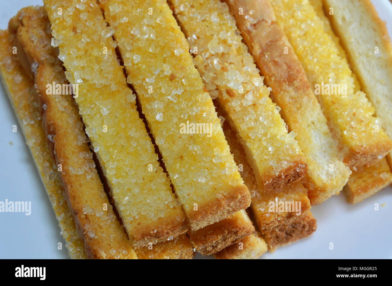 Pan tostado mantequilla azúcar topping en dish Fotografía de stock - Alamy