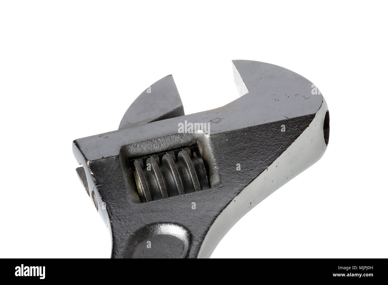 Close-up de una llave metálica herramienta mano aislado en blanco. Foto de stock