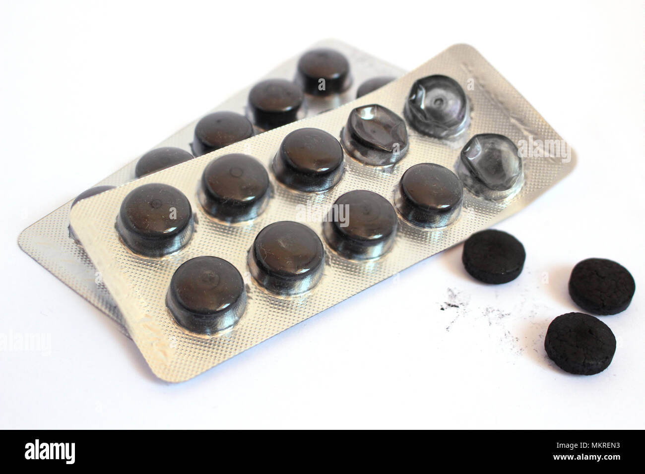 Diarrea pastillas de carbón negro Fotografía de stock - Alamy