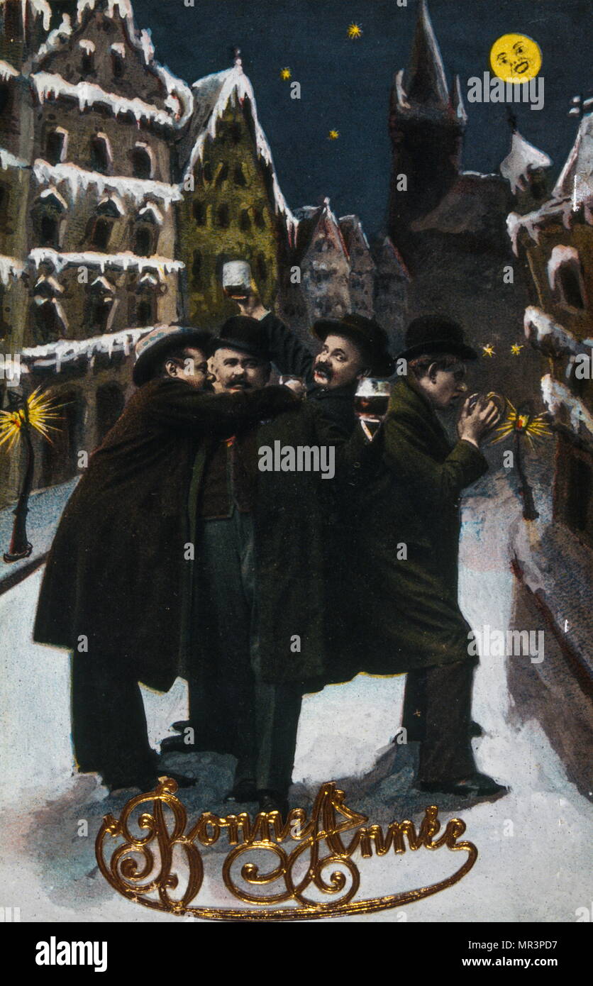 Francés Feliz Año Nuevo, postal que retrata a un grupo de hombres bebiendo y cantando en una calle en Navidad. 1900 Foto de stock