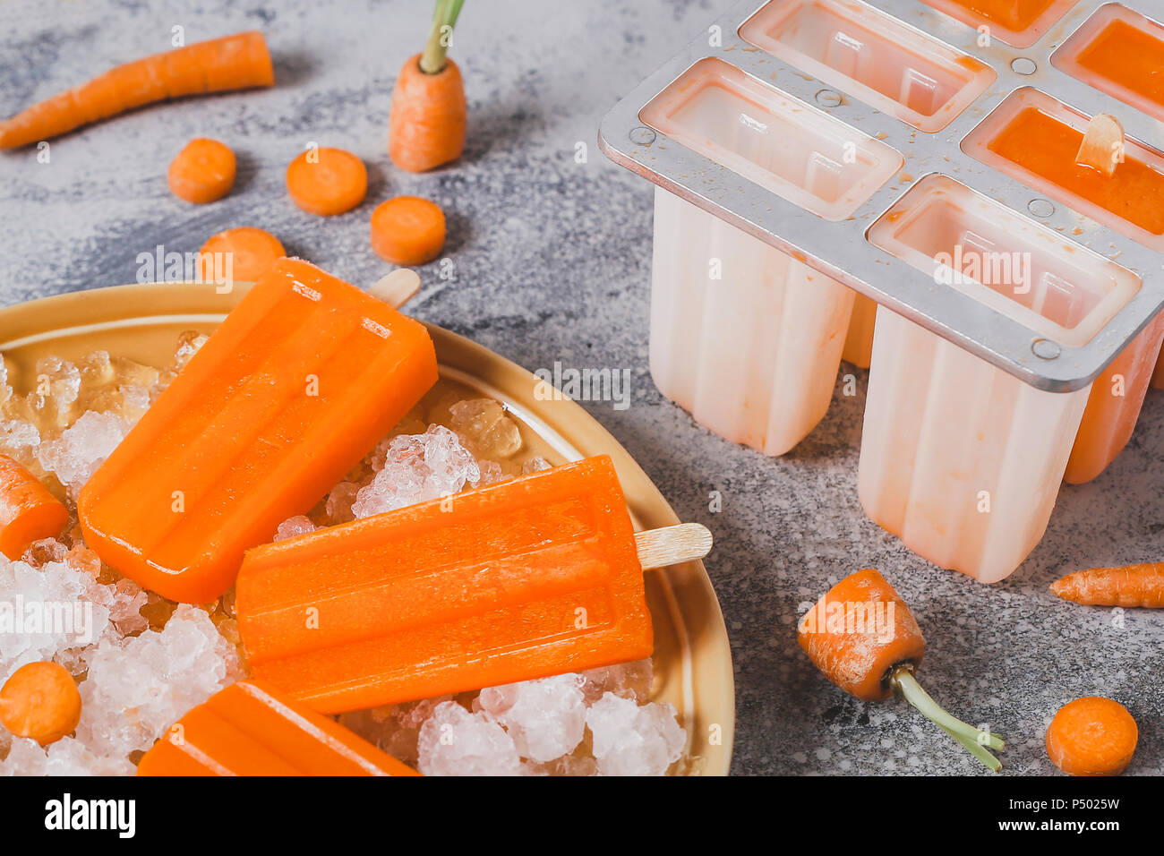 Zanahoria chupachupas hielo Foto de stock