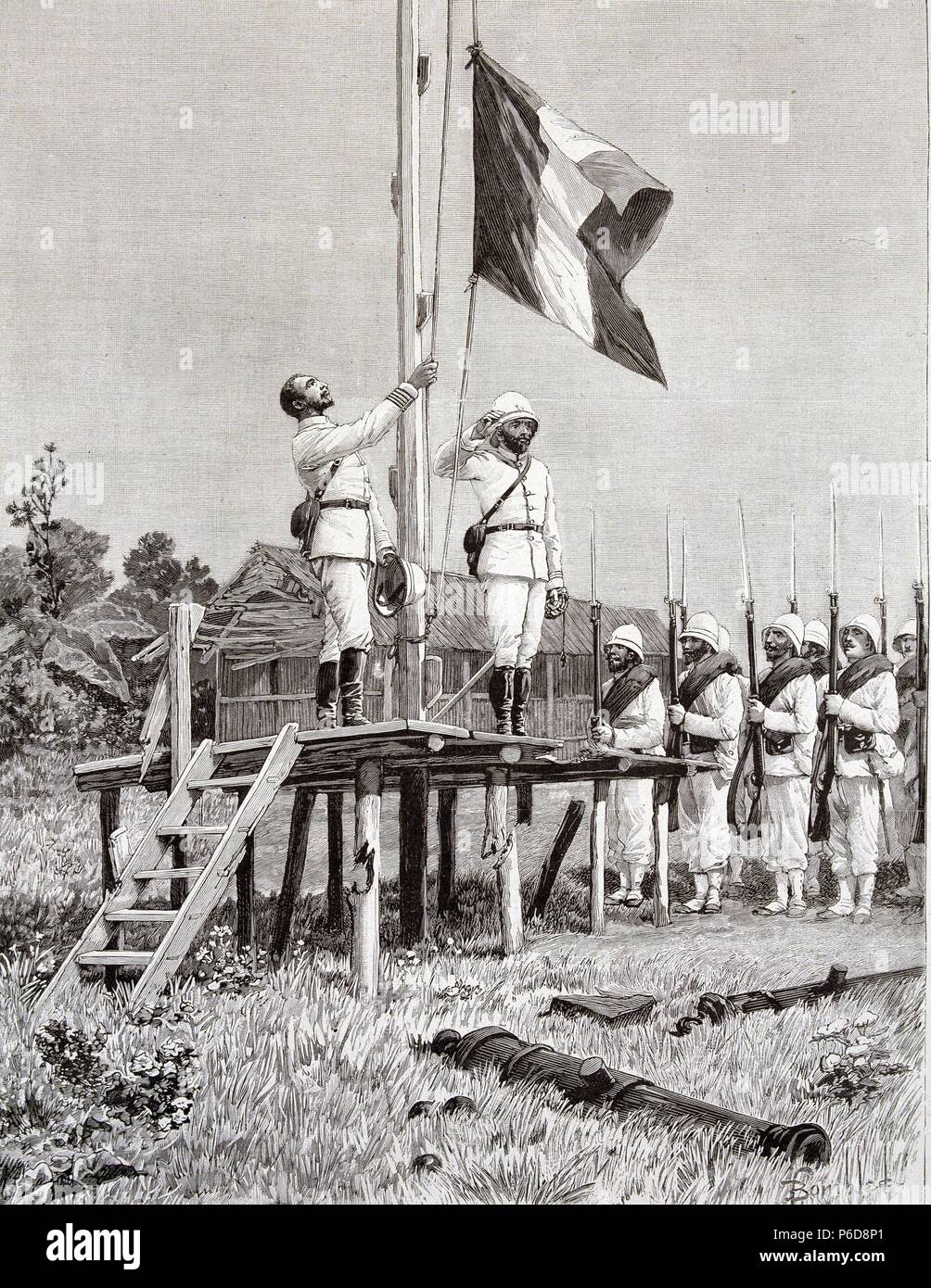 HISTORIA DE FRANCIA. COLONIZACION DE LA ISLA DE MADAGASCAR. EL COMANDANTE BIENAIME iza la bandera FRANCESA SOBRE EL PABELLÓN FRANCISCA DE MAROVOAY. GRABADO DE L¿ILLSTRATION 1899. Foto de stock