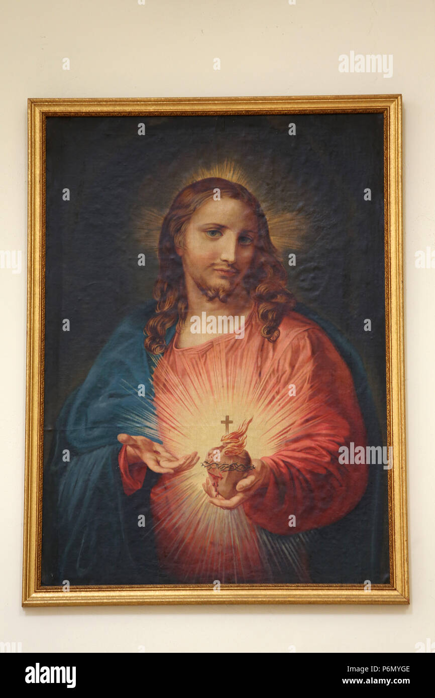 Pintura representando a Jesús mostrando su corazón sagrado en Madona Iglesia del Carmine, Nardo