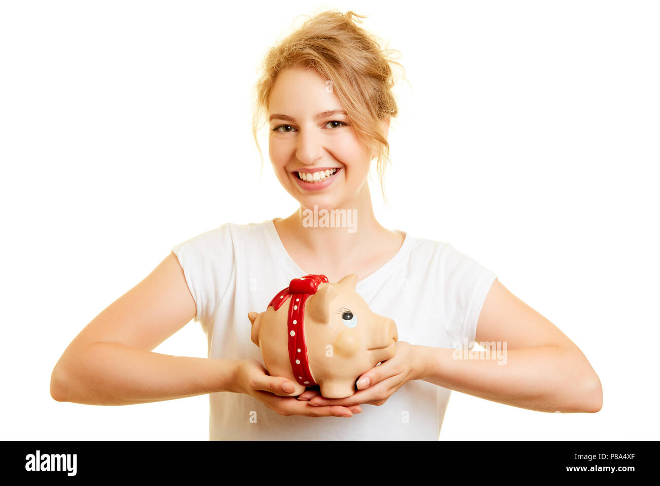 Joven Mujer rubia tiene hucha como un concepto de finanzas en sus manos Foto de stock