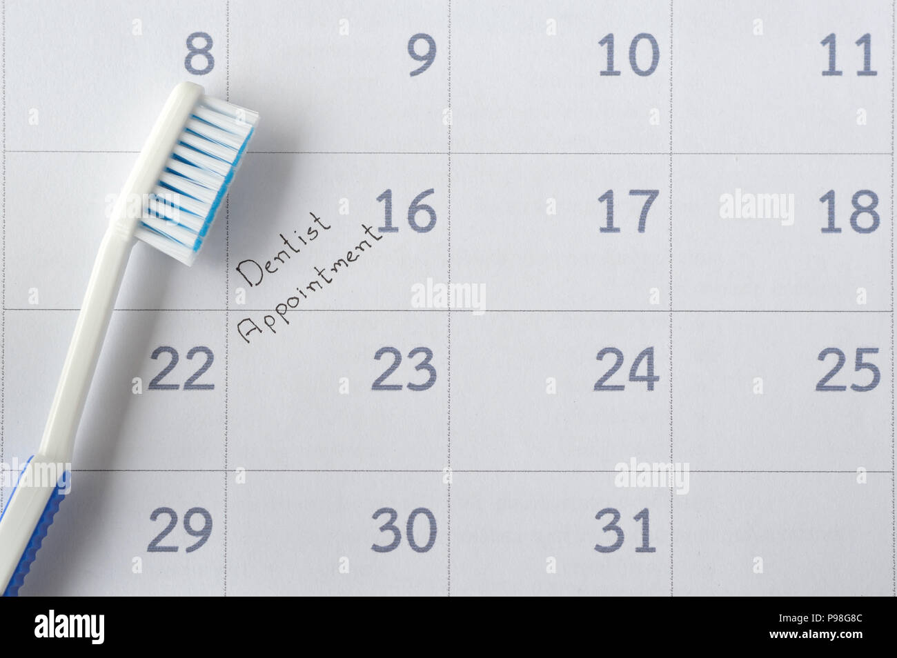 Dentista cita en Calendario planner con cepillo para el recordatorio Foto de stock