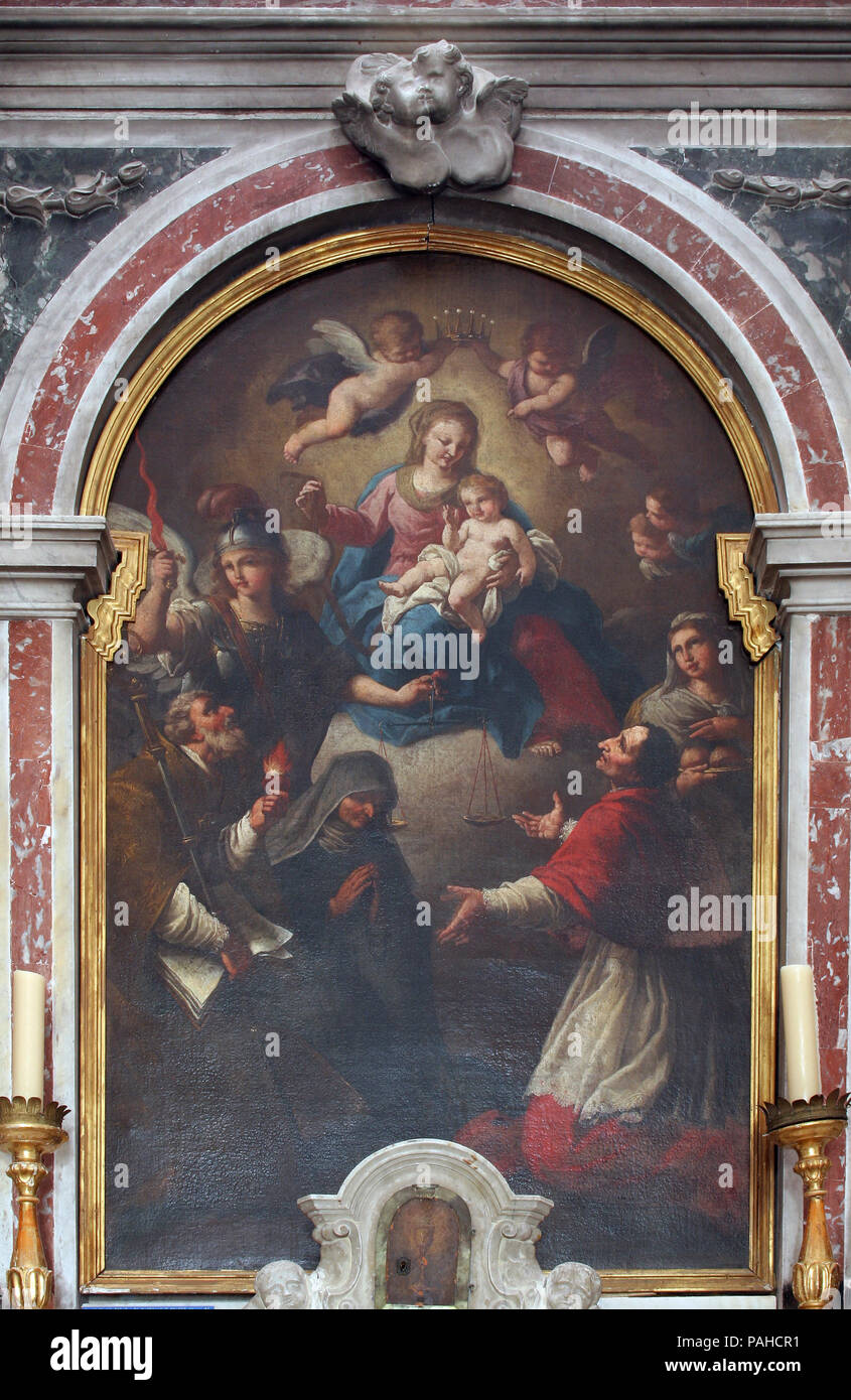 La Virgen María con el Niño Jesús y los Santos, el retablo de la Iglesia de San Miguel en Korcula, la isla de Korcula, Croacia Foto de stock