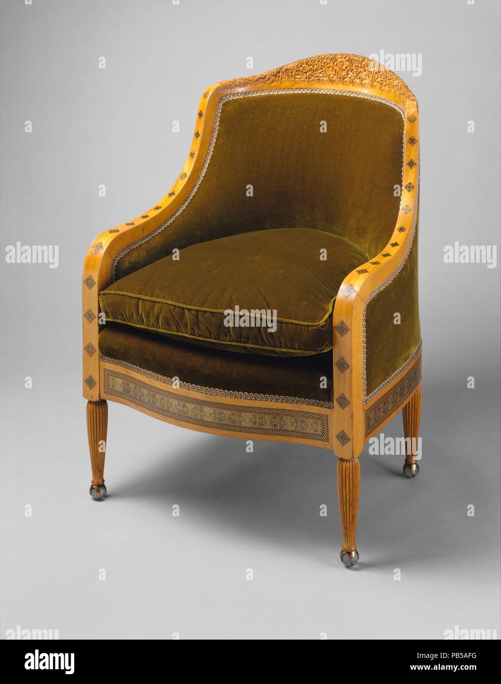 Sillón. Cultura: American. Dimensiones: 35 5/8 x 25 1/4 x 26 1/8 pulg. (90,5 x 64,1 x 66,4 cm). Maker: Tiffany Glass y decoración de la Empresa (American, 1892-1902); Louis Comfort Tiffany (Americano, Nueva York, Nueva York, 1848-1933). Fecha: ca. 1891-93. Este sillón y su compañero (64.202.2) que una vez fueron parte de un paquete que incluía un gran sofá y dos sillones de damas más pequeños (Detroit Institute of Arts y el Museo de Arte de Cleveland). Se atribuyen a Louis Comfort Tiffany, debido a las similitudes compartidas con muebles diseñados para Tiffany y Louisine Havemeyer H. O. En la Quinta Avenida en Nueva Casa Foto de stock
