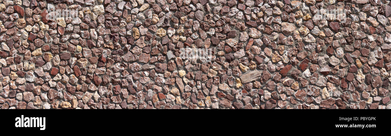 Panorama de una pared de piedra rojiza Foto de stock