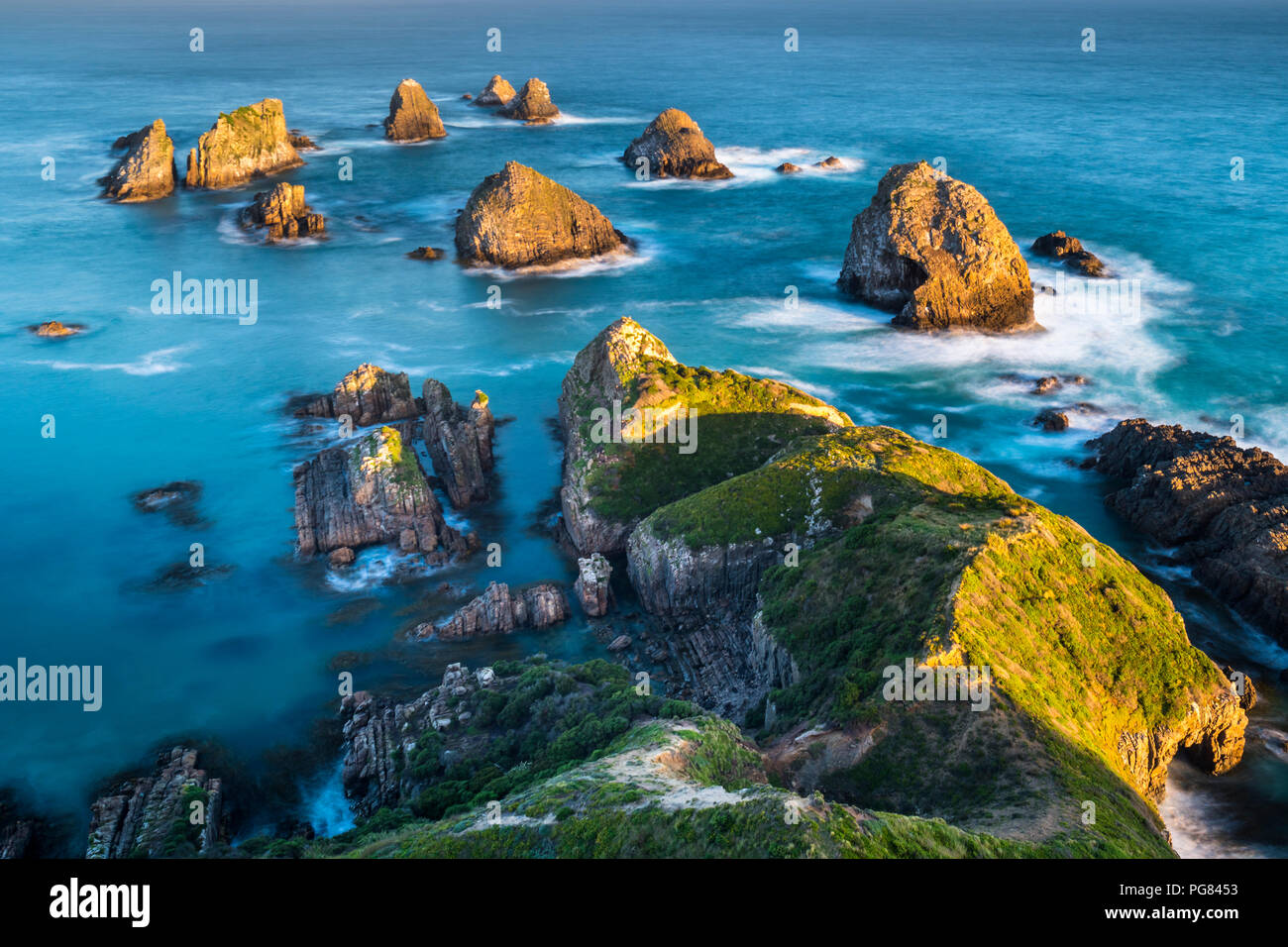Nueva Zelanda, Isla del Sur, Sur de Ruta Escénica, Catlins, sunset de Nugget Point Foto de stock