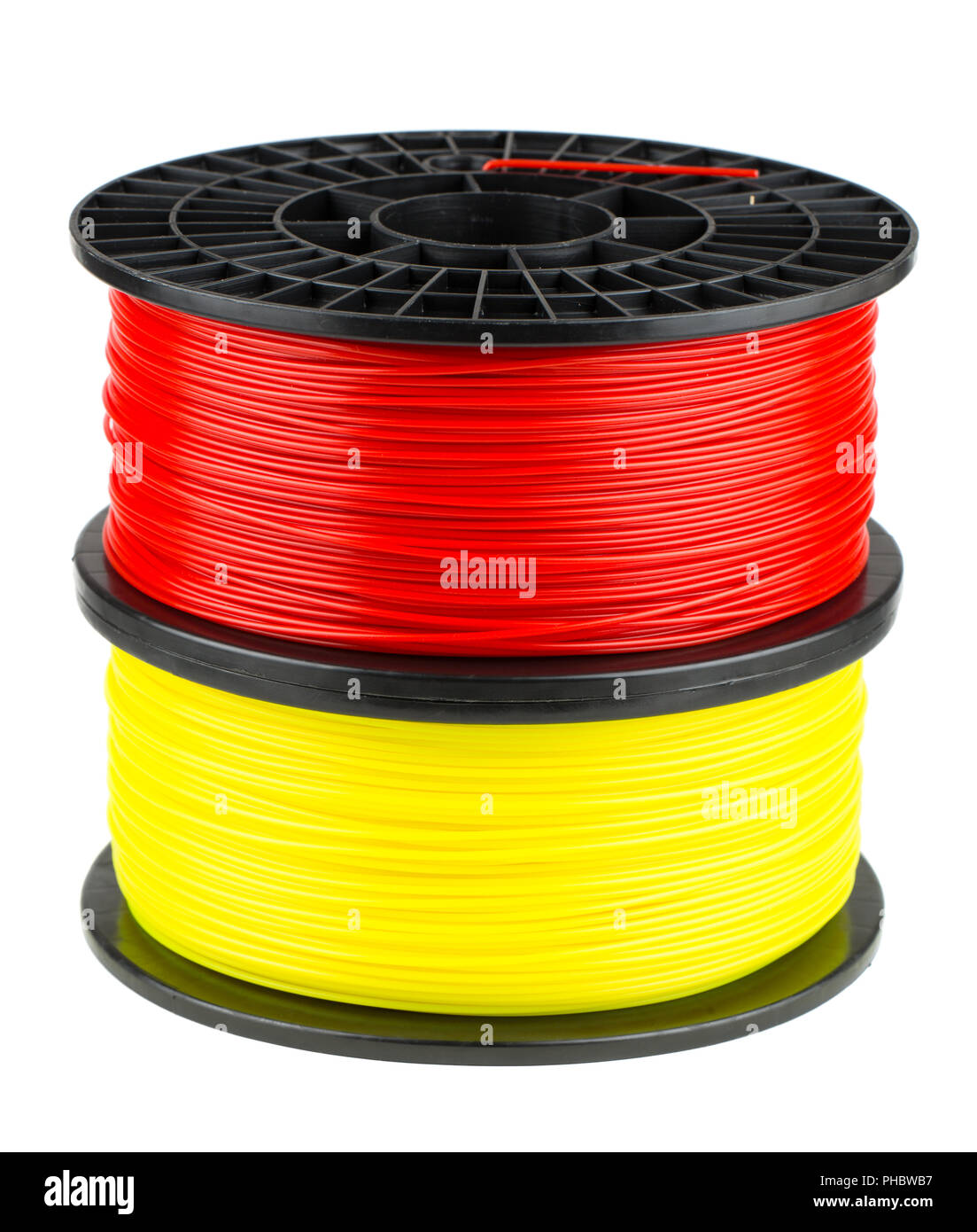 Filamento rojo y amarillo de bobinas para impresión 3D Foto de stock