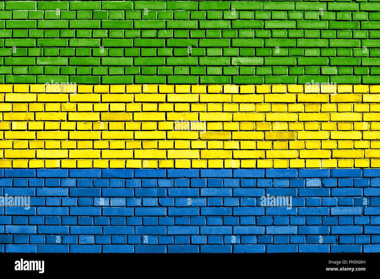 Bandera de Gabón pintado sobre la pared de ladrillo Foto de stock