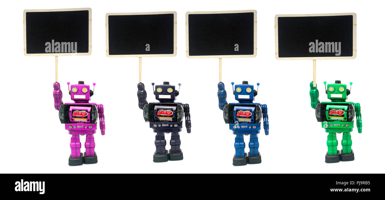 Cuatro manifestante; robots en blanco Foto de stock