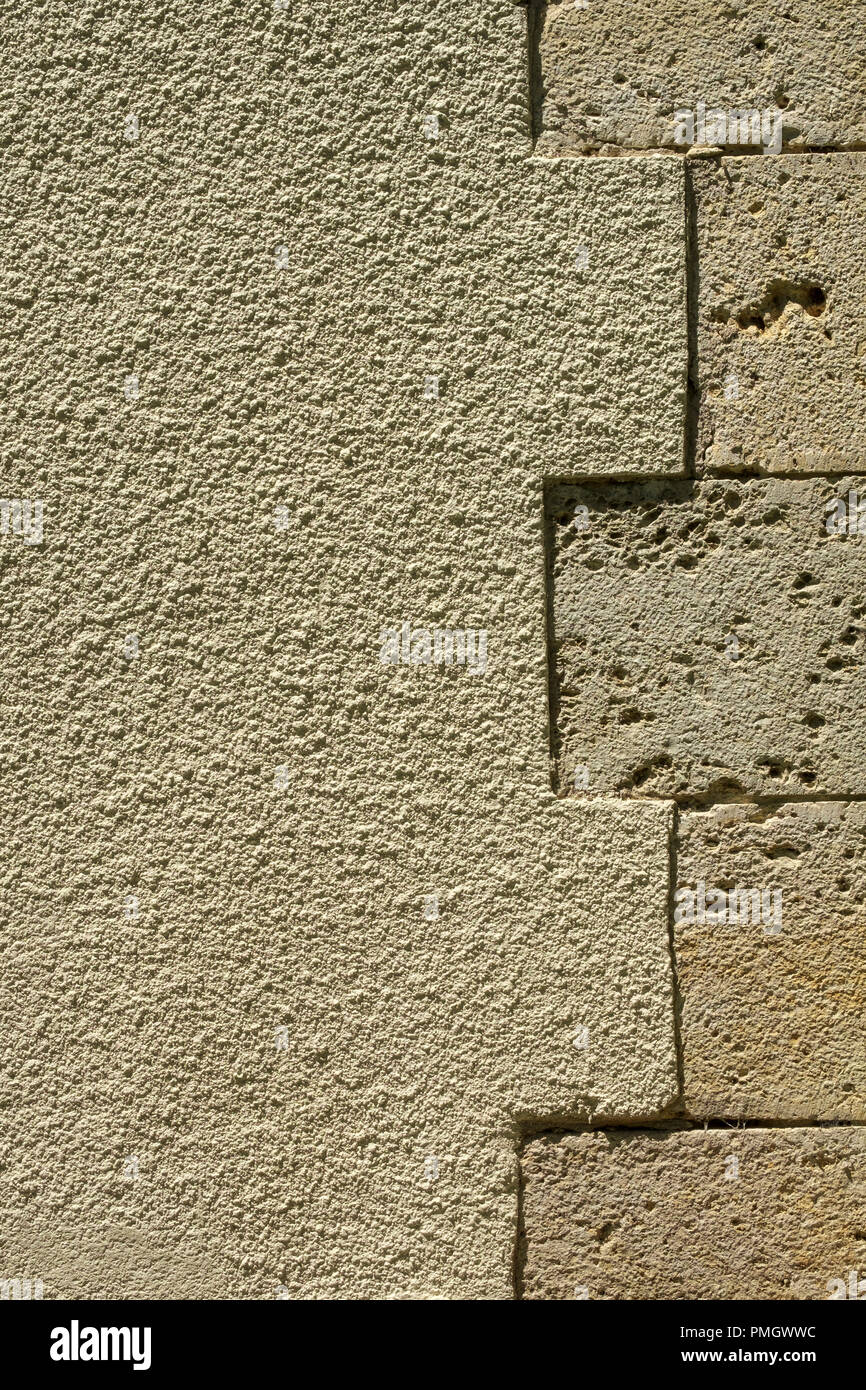 Vestida de piedra y representar una pared exterior detalle de antecedentes de fotograma completo Foto de stock
