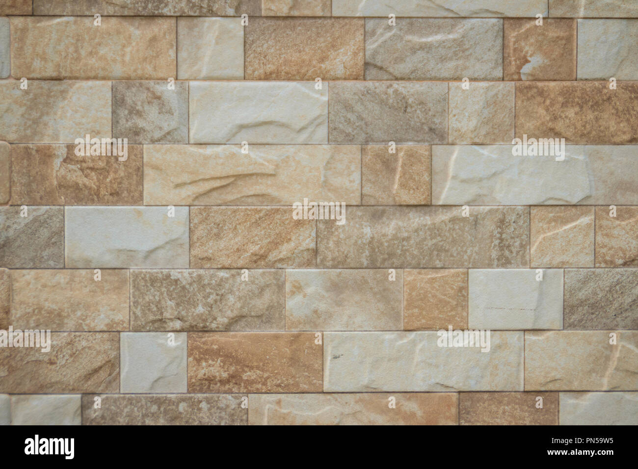 Baldosas de piedra destacados wall textura de fondo. Limpiar y ordinaria de  baldosa de piedra telas Fotografía de stock - Alamy