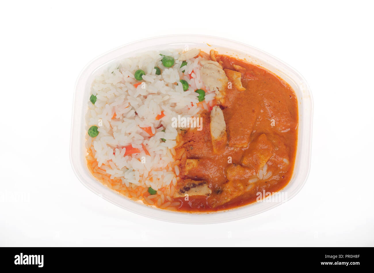 Cocina Microwaved zLean congelador cocidos listos para comer pollo tikka masala con arroz en la bandeja Foto de stock