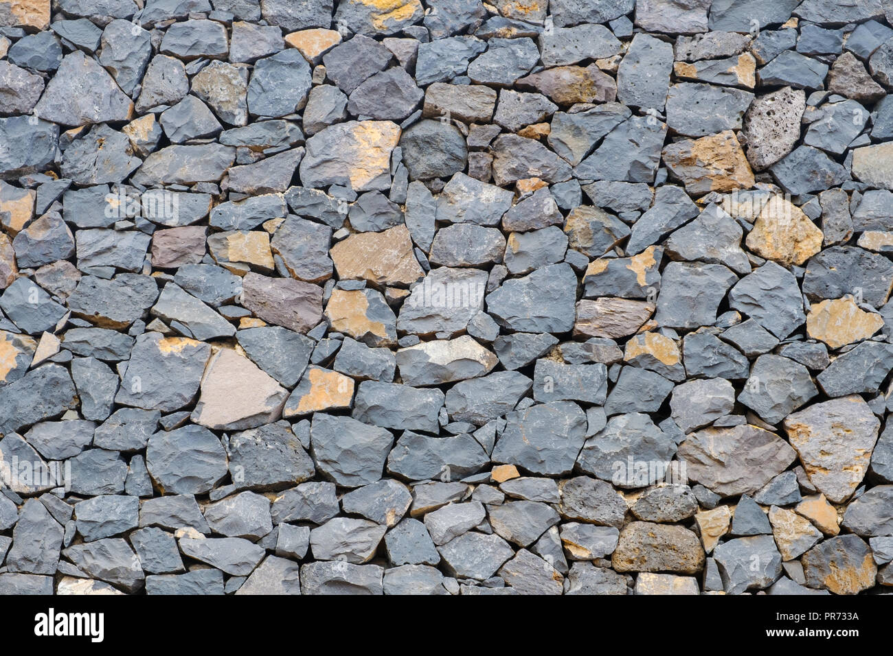 Muro de piedra natural de fondo. La textura de un muro de piedra - Foto de stock