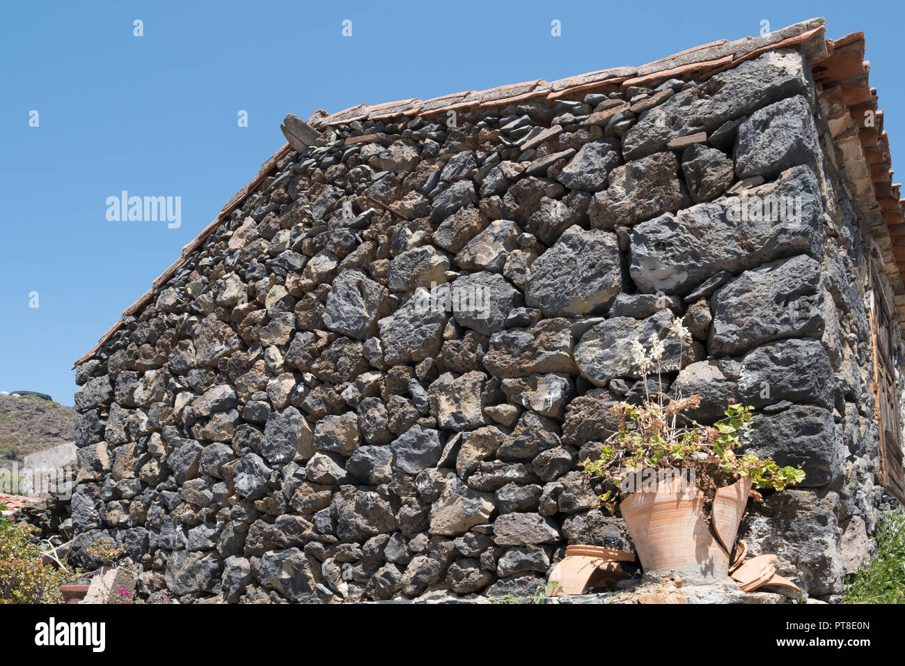 Casa antigua con la fachada de piedra natural wall Foto de stock
