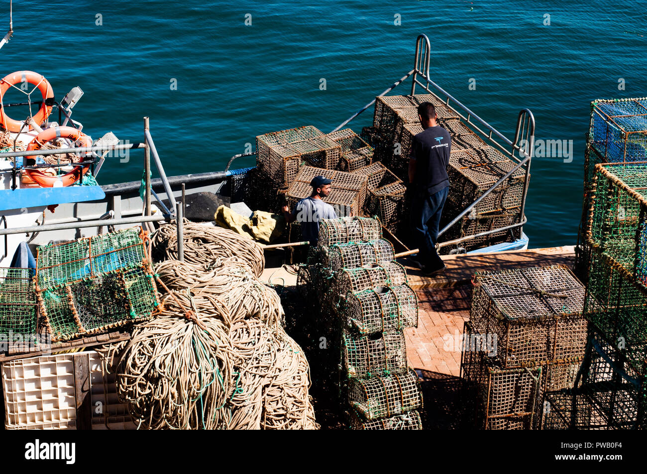 Pescador empacando para capturas de pesca pulpo Foto de stock