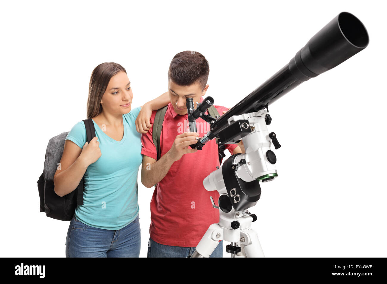 Adolescente y un adolescente mirando a través de un telescopio aislado sobre fondo blanco. Foto de stock