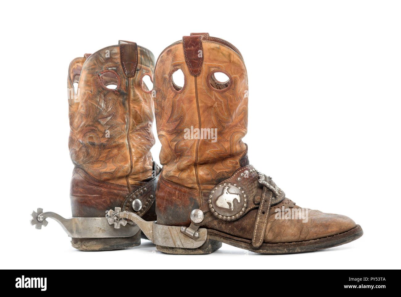 cavar tono ganso Vista lateral de un par de botas de vaquero con espuelas, aislado en blanco  Fotografía de stock - Alamy