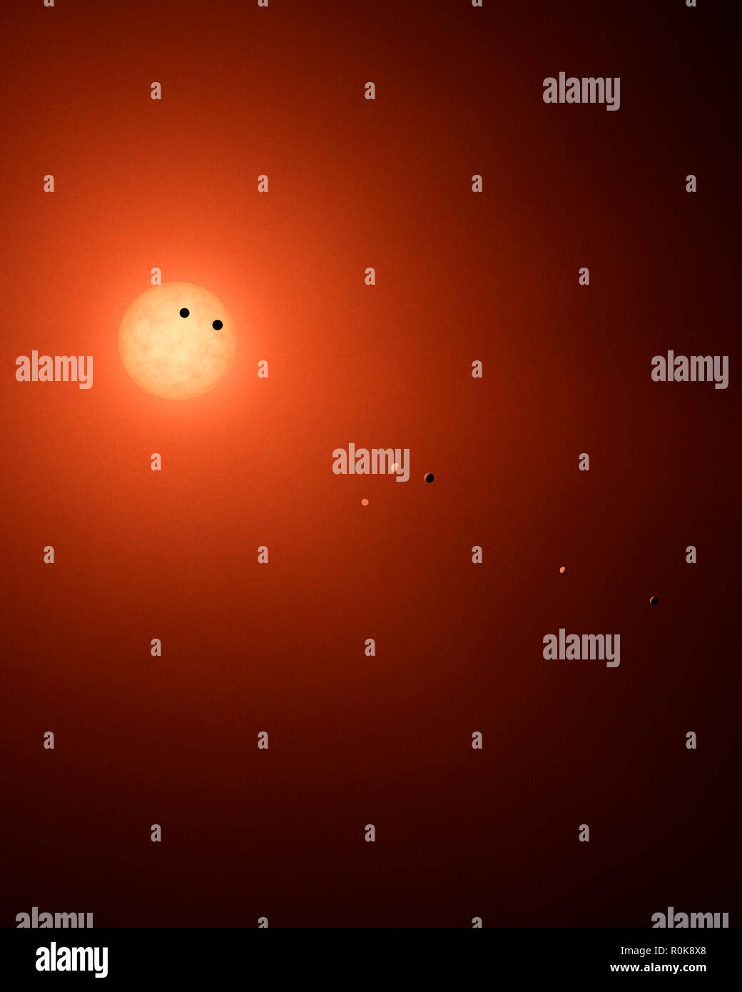 Concepto artístico de los siete trapenses-1 planetas en órbita alrededor de su Sol. Foto de stock