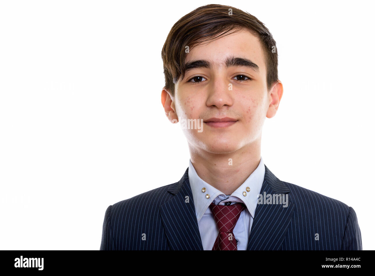 Foto de estudio de joven apuesto empresario adolescente persa Foto de stock