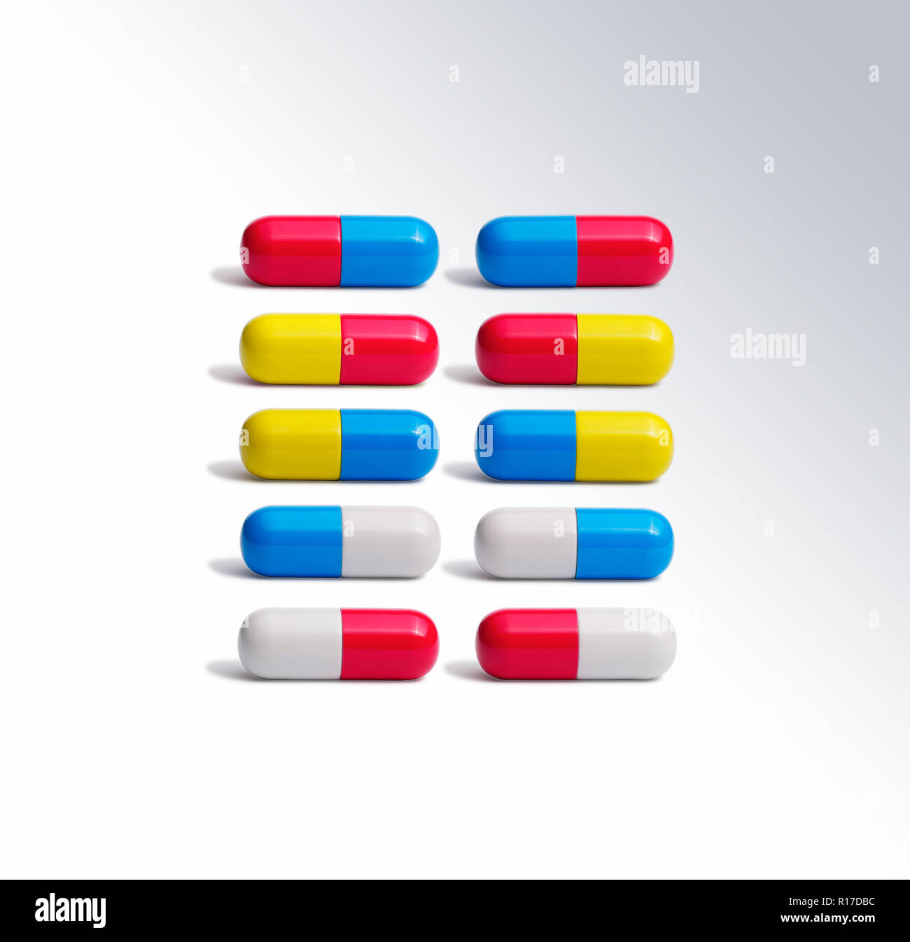 Ocho coloridas píldora medicamento cápsulas de lado a lado, todavía la vida Foto de stock