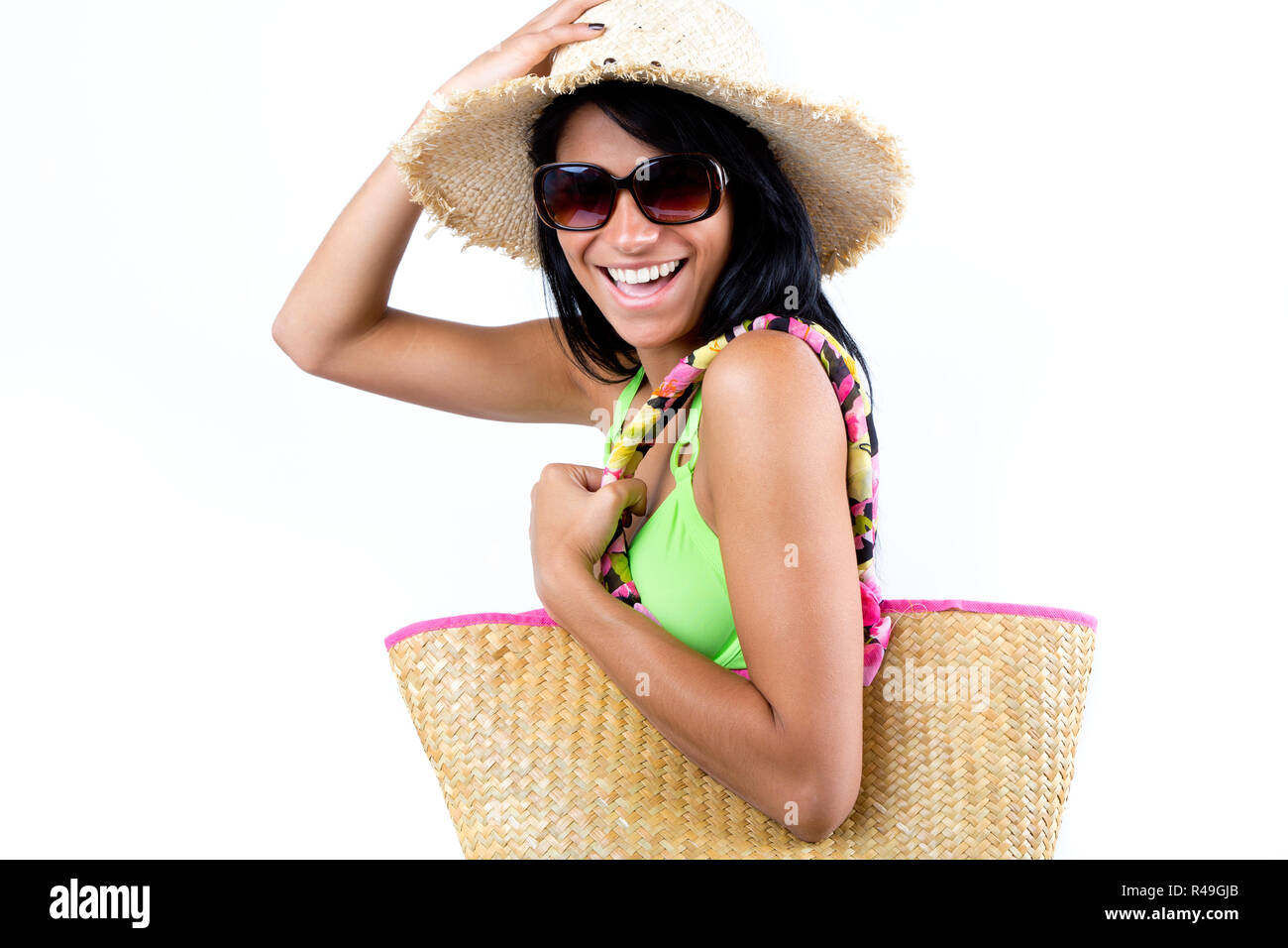 Feliz muchacha con sombrero y bikini verde Foto de stock