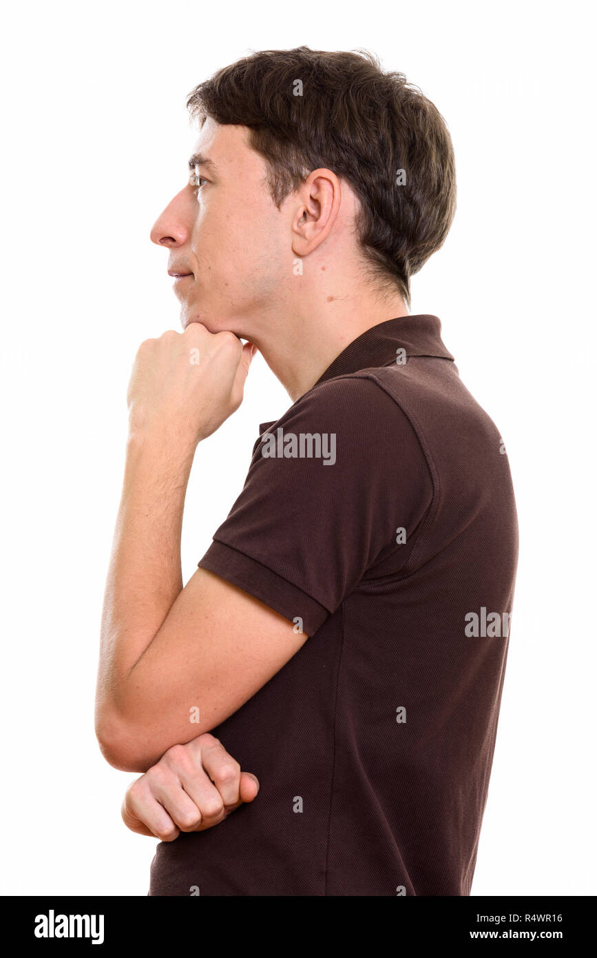 Ver perfil de hombre pensando con la mano en la barbilla Foto de stock