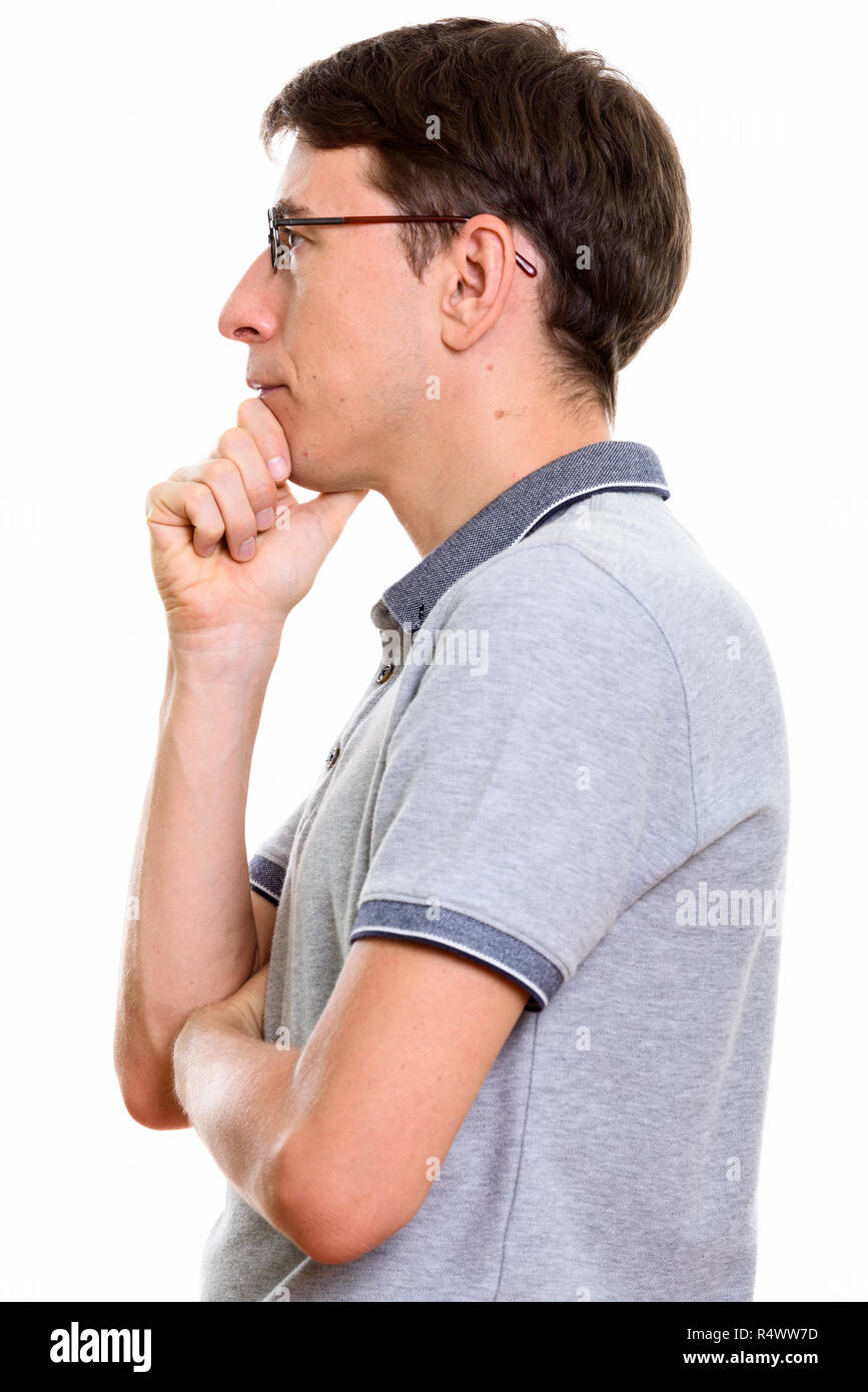 Ver perfil de hombre pensando con la mano en la barbilla Foto de stock