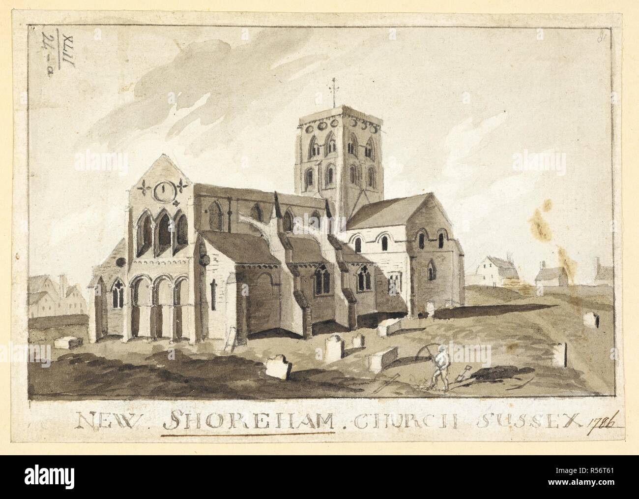 Una cifra cavar una tumba en el cementerio de Nueva Shoreham Iglesia