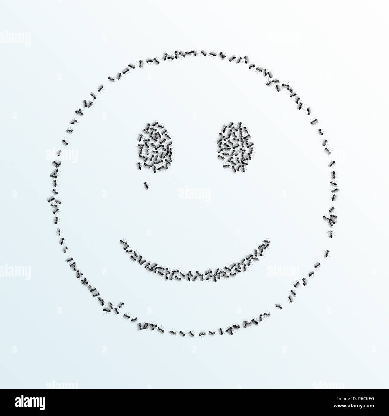 Imagen digital monocroma de hormigas formando un esbozo de una cara sonriente sobre un fondo blanco. Foto de stock