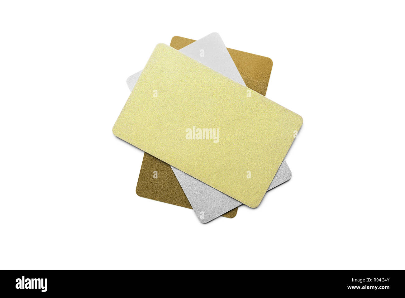 Tres de bronce, plata y oro de tarjetas plásticas poniendo uno encima de otro Foto de stock