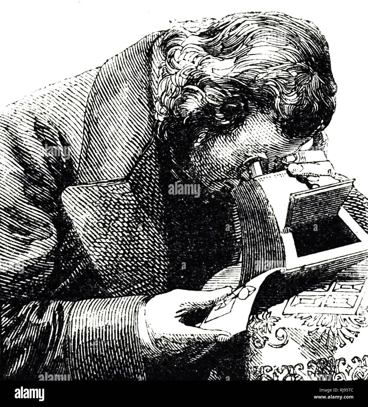 Un grabado que retrata a un hombre con un estereoscopio, un dispositivo por el cual dos fotografías del mismo objeto tomadas en ángulos ligeramente distintos se consideran juntos, creando una impresión de profundidad y solidez. Fecha del siglo XIX Foto de stock